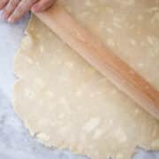 Foolproof Vodka Pie Crust dough rolled with rolling pin