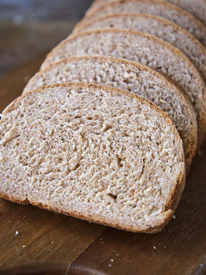 Whole wheat bread sliced on board