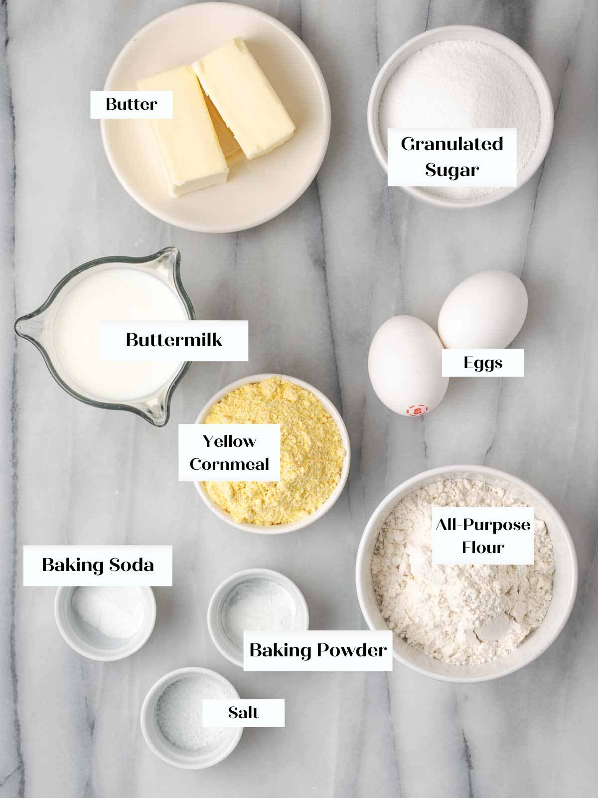 sweet cornbread ingredients on marble.