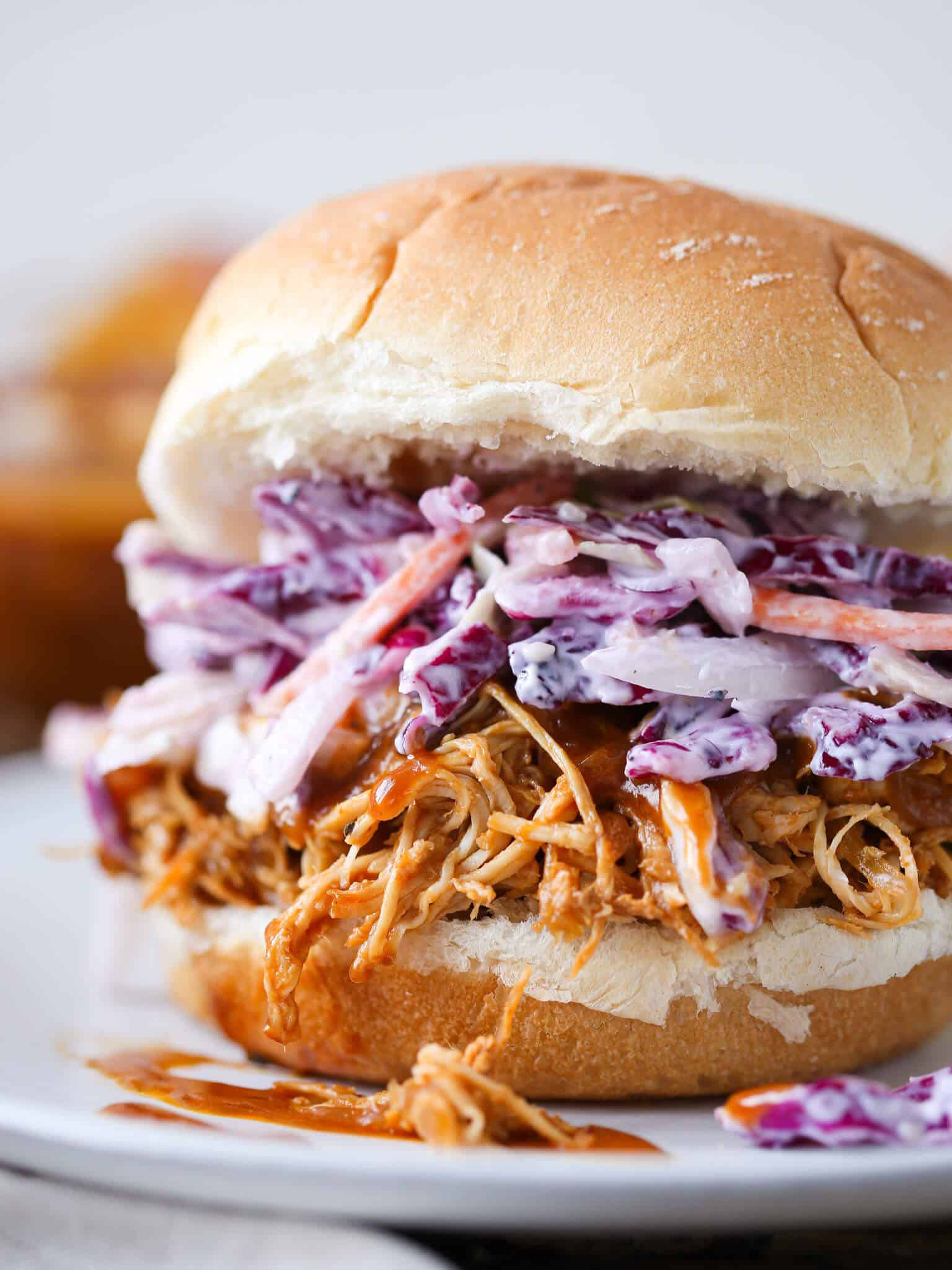 https://cheflindseyfarr.com/wp-content/uploads/2013/05/slowcooker-barbecue-pulled-chicken-sandwich-slaw.jpg