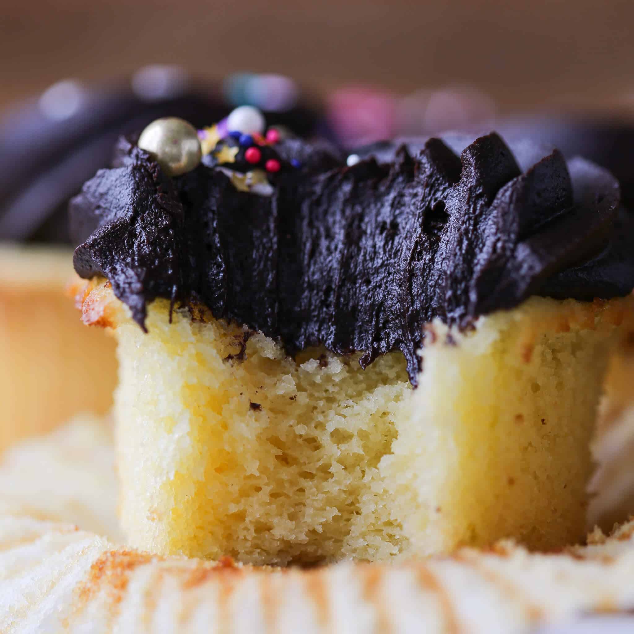 Yellow Cupcakes with Chocolate frosting bitten