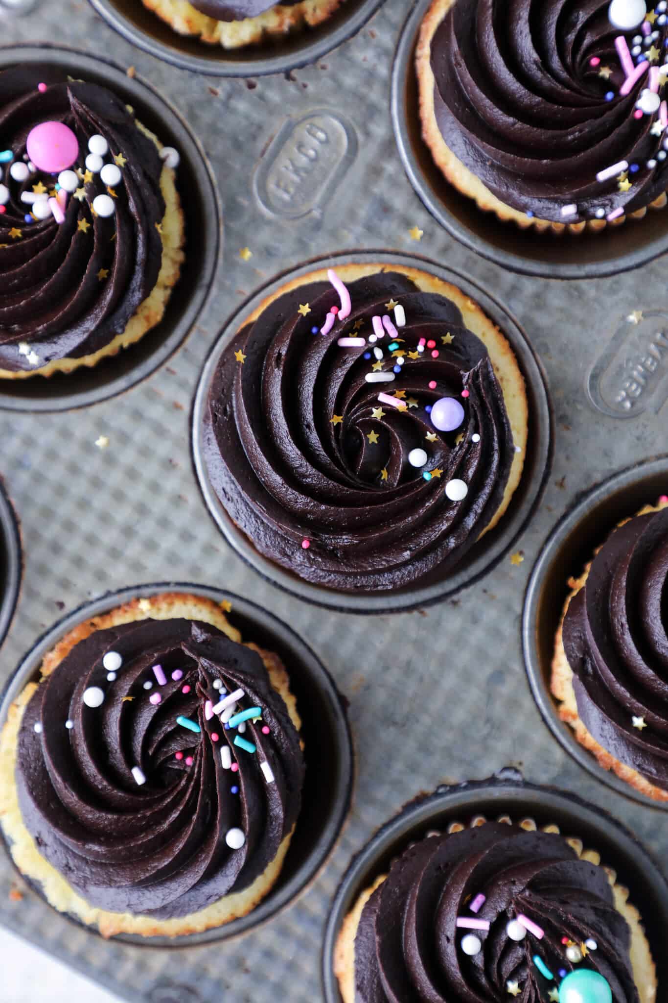 Yellow Cupcakes with Chocolate frosting in vintage baking tin