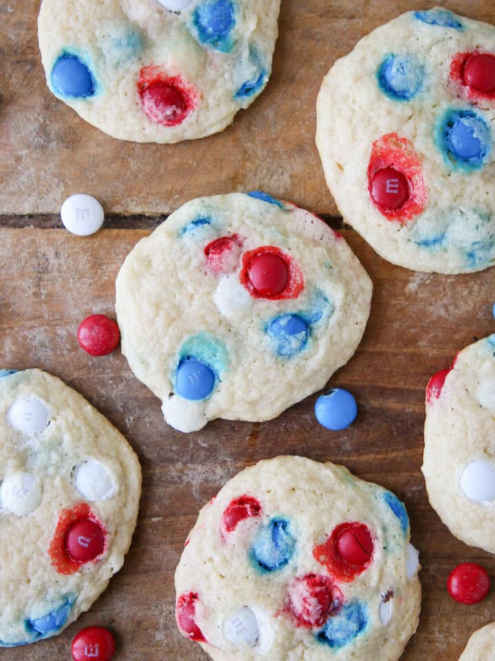 Patriotic M&M Sugar Cookies on wooden surface with m&ms