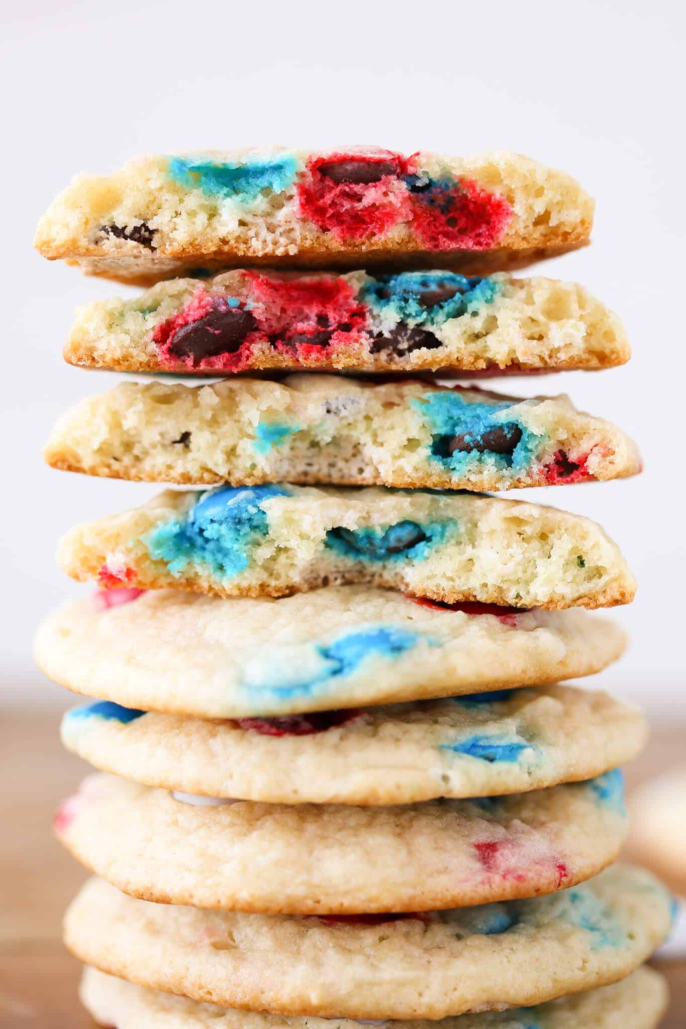 Patriotic M&M Sugar Cookies broken open tall stack