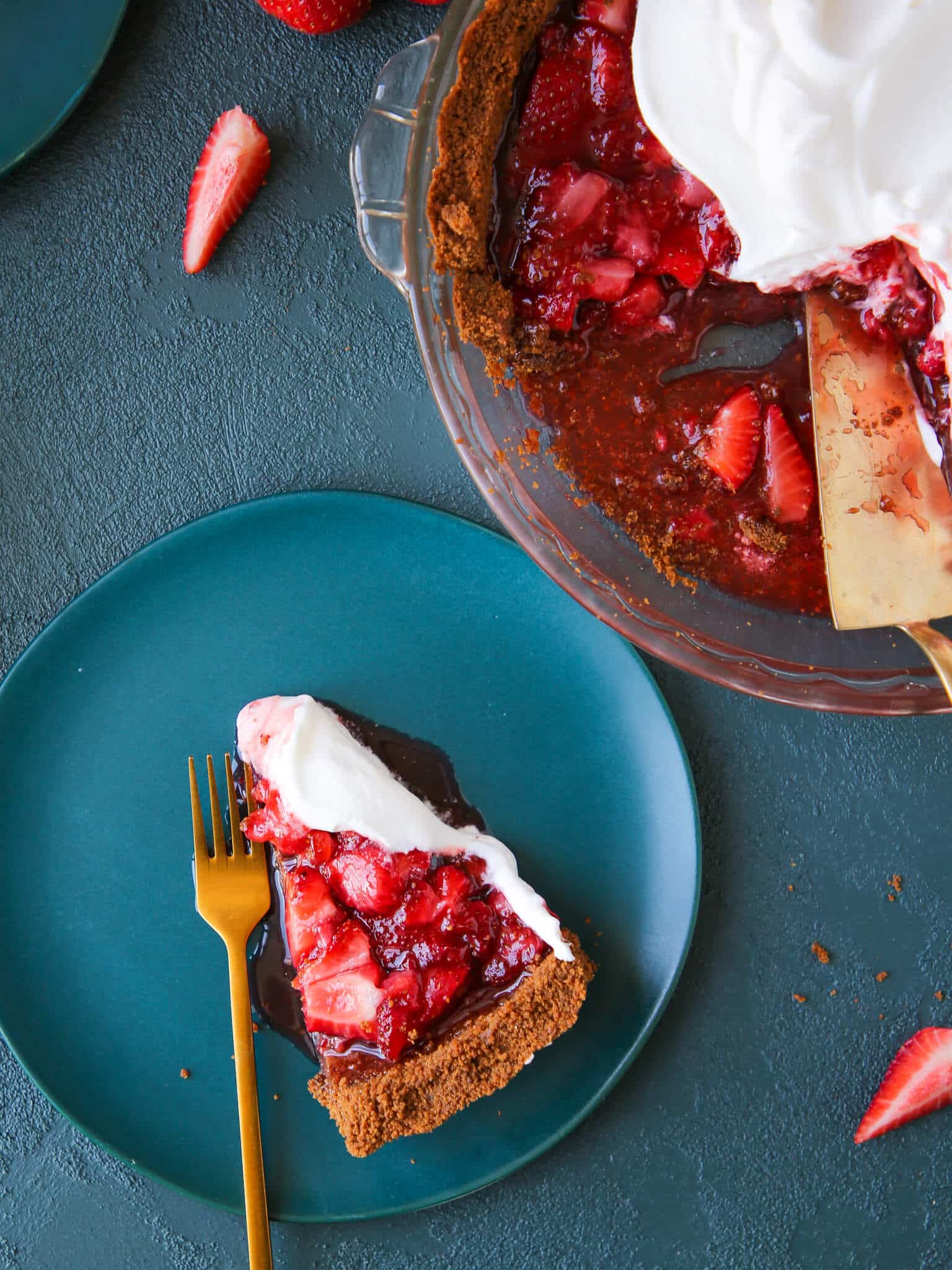 Strawberry Triumph Pie slice next to whole pie