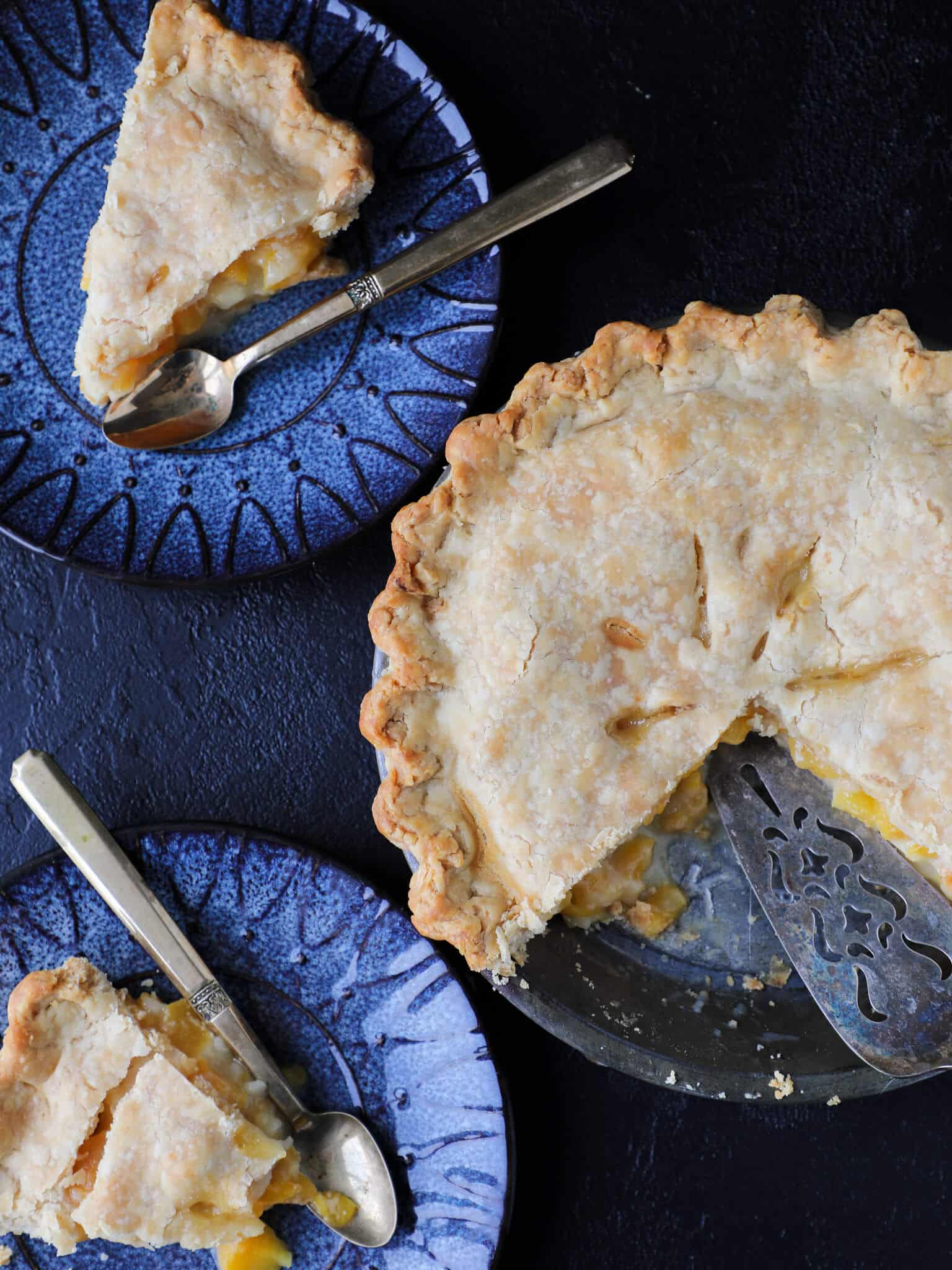 Peach Pie slices on blue plates.