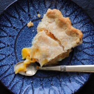 Old Fashioned Peach Pie sliced with vintage gold fork