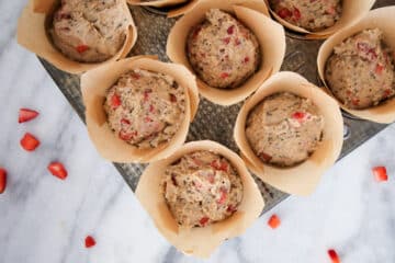 Strawberry Whole Wheat Muffin batter in brown tulip liner