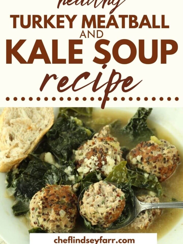 Meatball and kale soup in a white bowl.