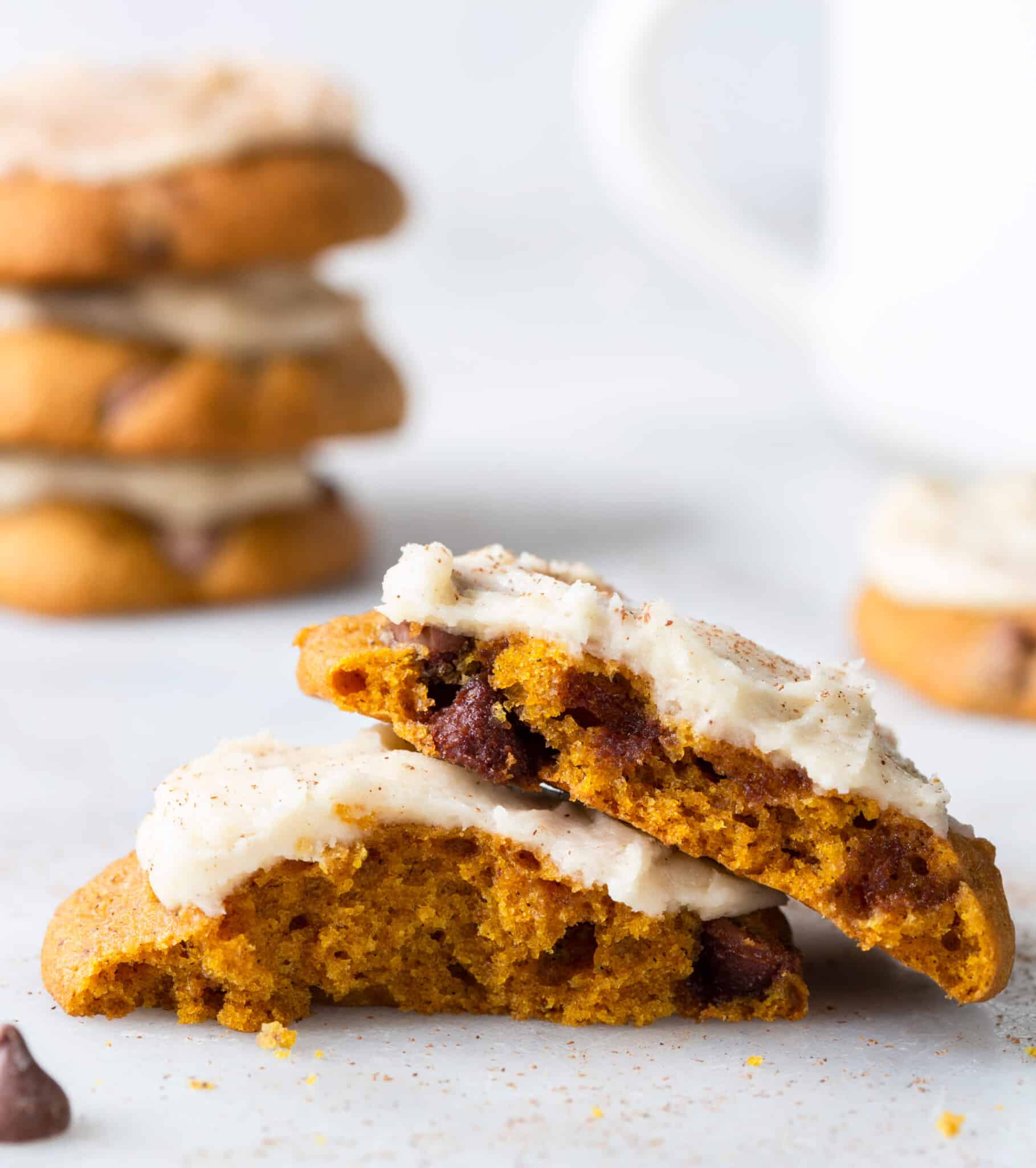 chewy chocolate chip pumpkin cookies with browned butter icing close up interior