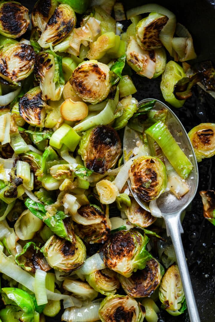 Brussels Sprouts and Leeks with Lime ginger butter close up on spoon