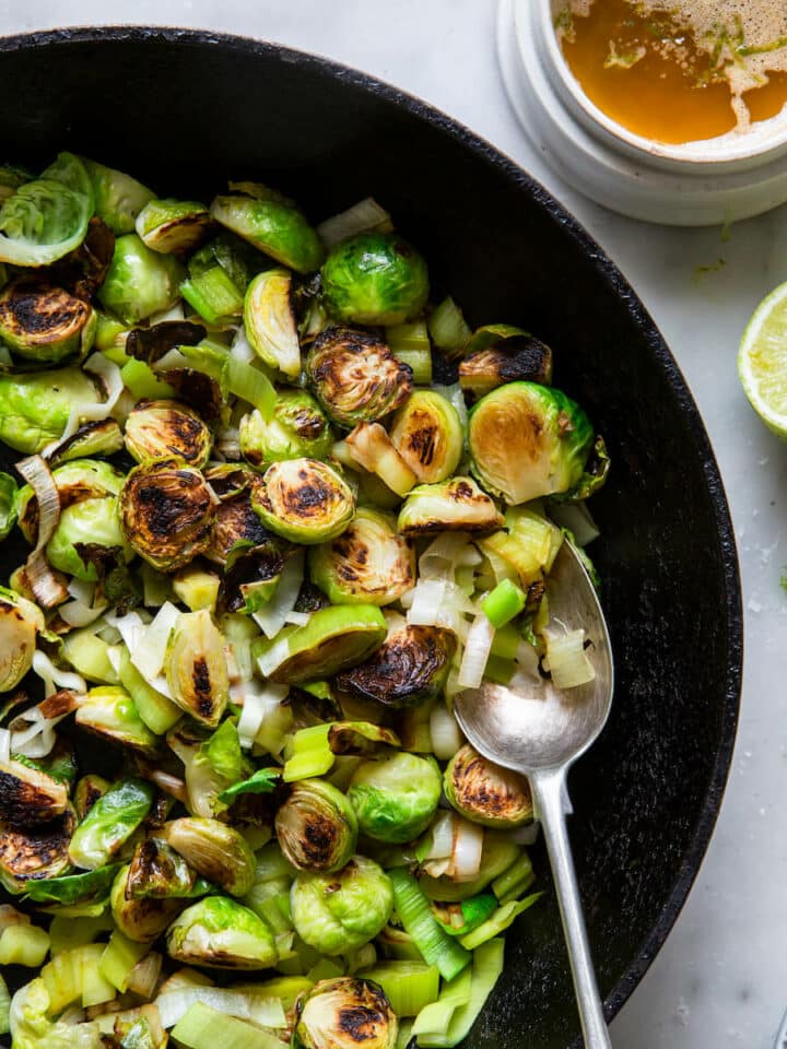 Brussels Sprouts and Leeks with Lime ginger butter in skillet