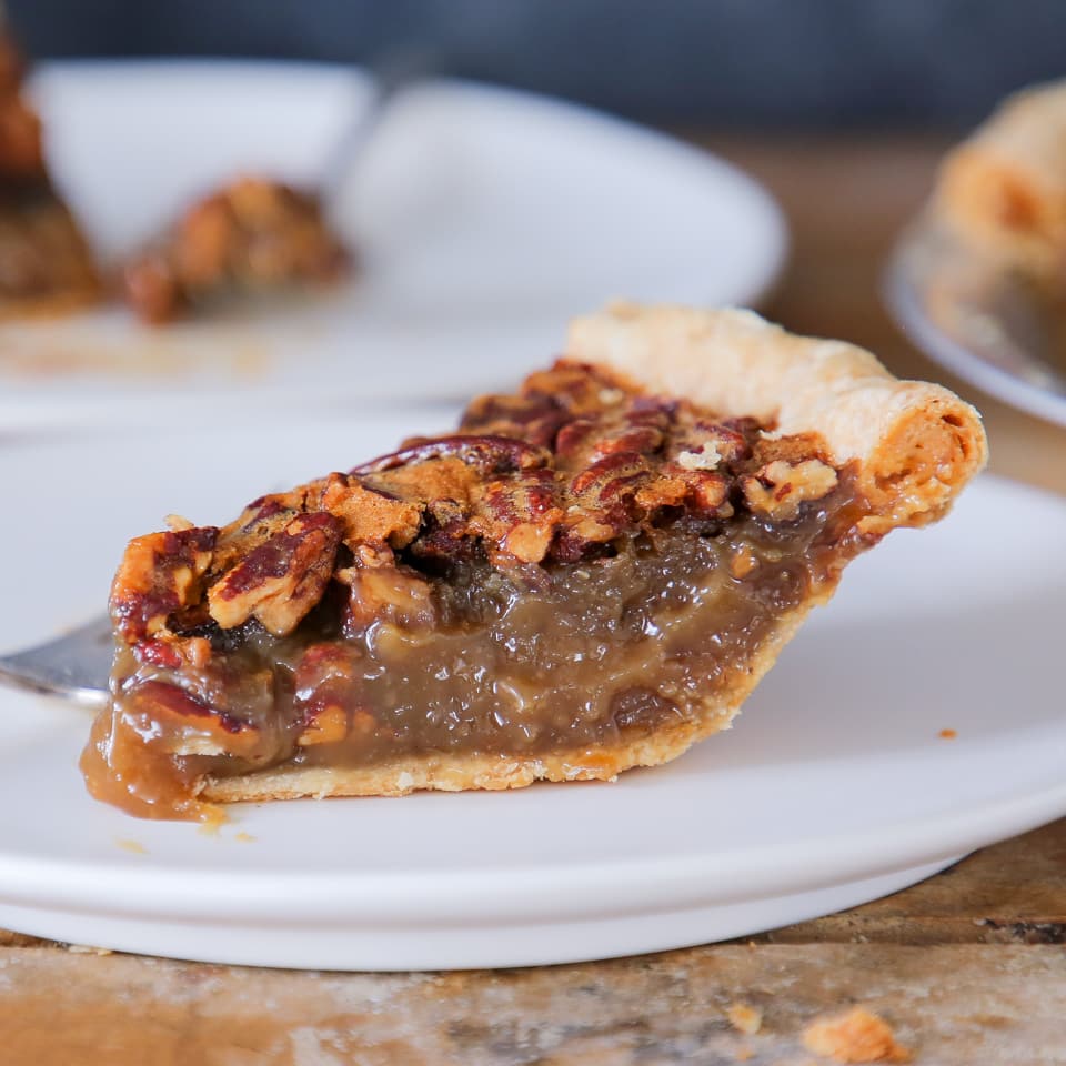 Classic Pecan Pie slice on plate side view