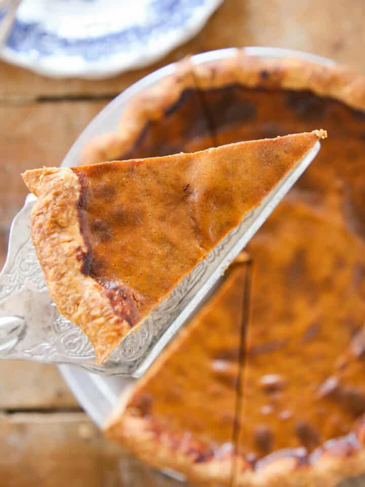 Foolproof Pumpkin Pie slice on silver pie server