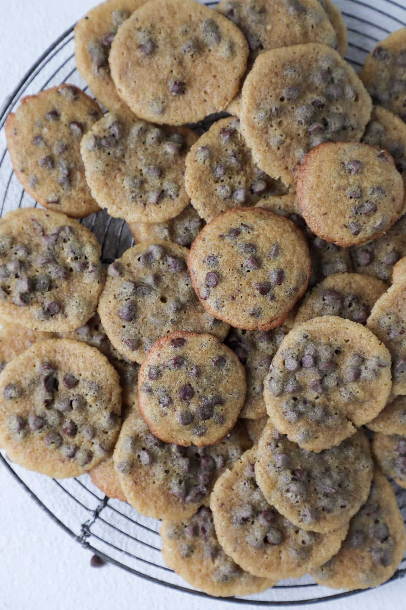 Mini Chocolate Chip Cookies Close piled on cooling rack