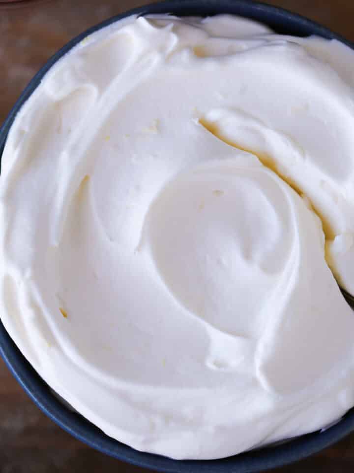 Lemon Whipped Cream in blue bowl with spoon