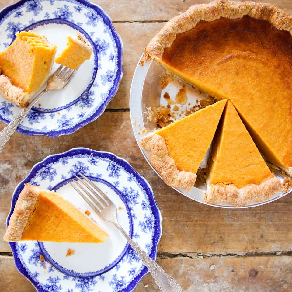 Mary Randolph's Sweet Potato Pie sliced on blue plates