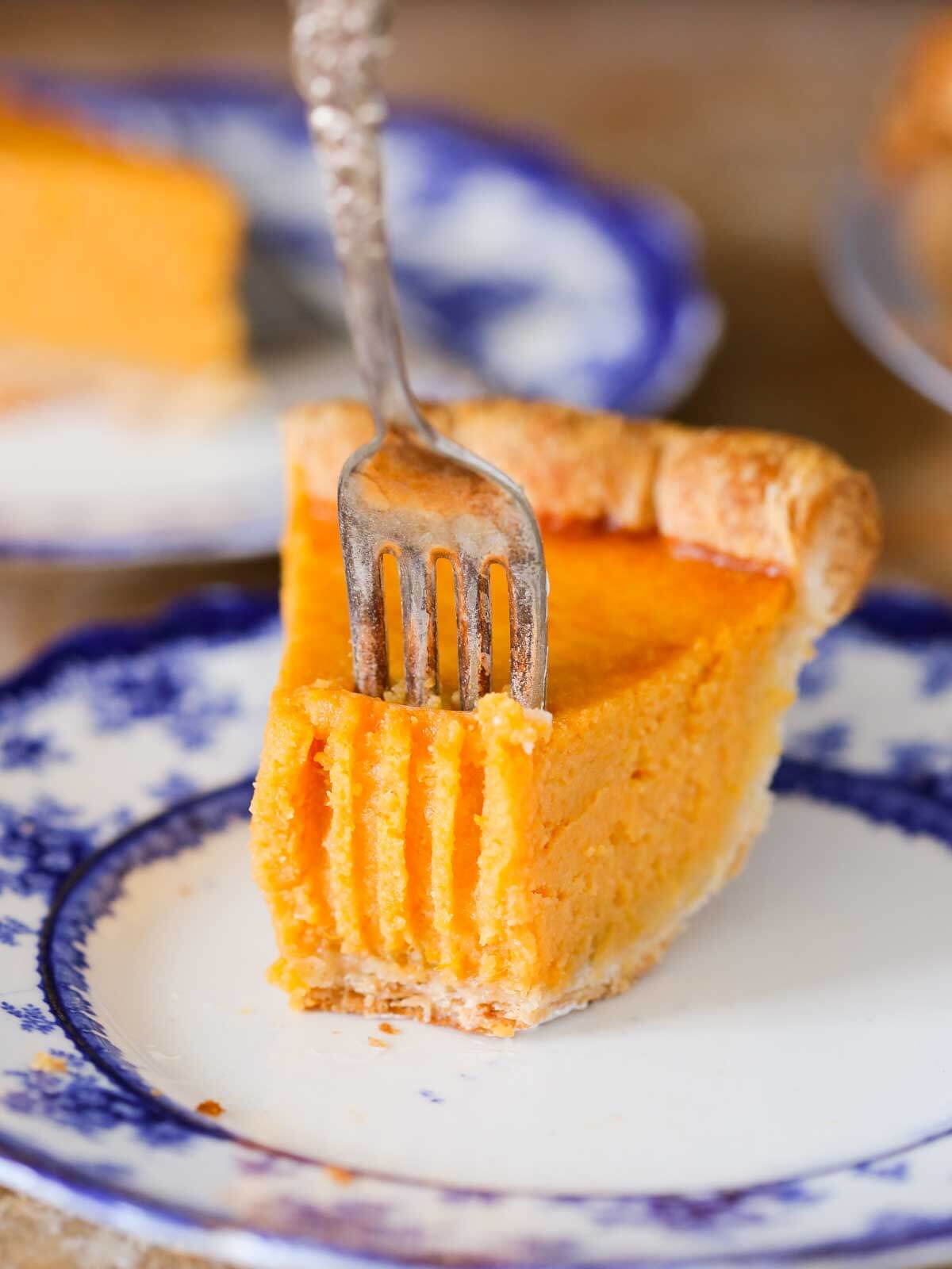 sweet potato pie slice with fork marks and fork.