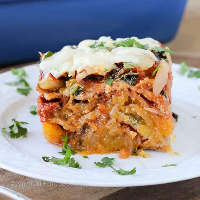 Spaghetti squash lasagna with fresh herbs on top.