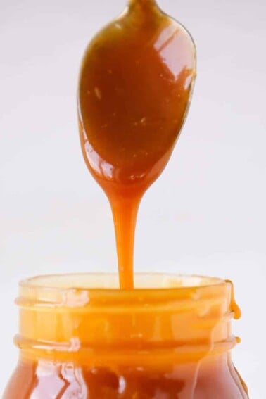 The Best Salted Caramel Sauce detail dripping from spoon