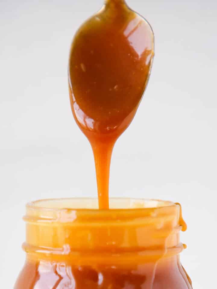 The Best Salted Caramel Sauce detail dripping from spoon