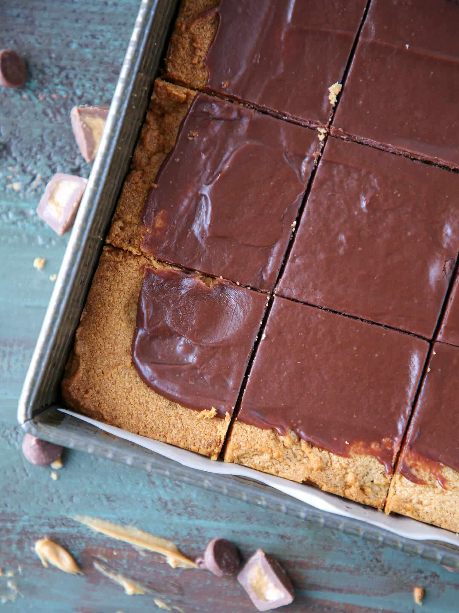 Fudgy Peanut Butter Reeses Chocolate Bars sliced in vintage baking tin