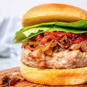 turkey burger with caramelized onions and soft bun.
