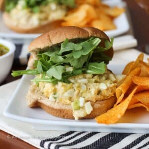 A tuna melt sandwich with a cloth napkin.