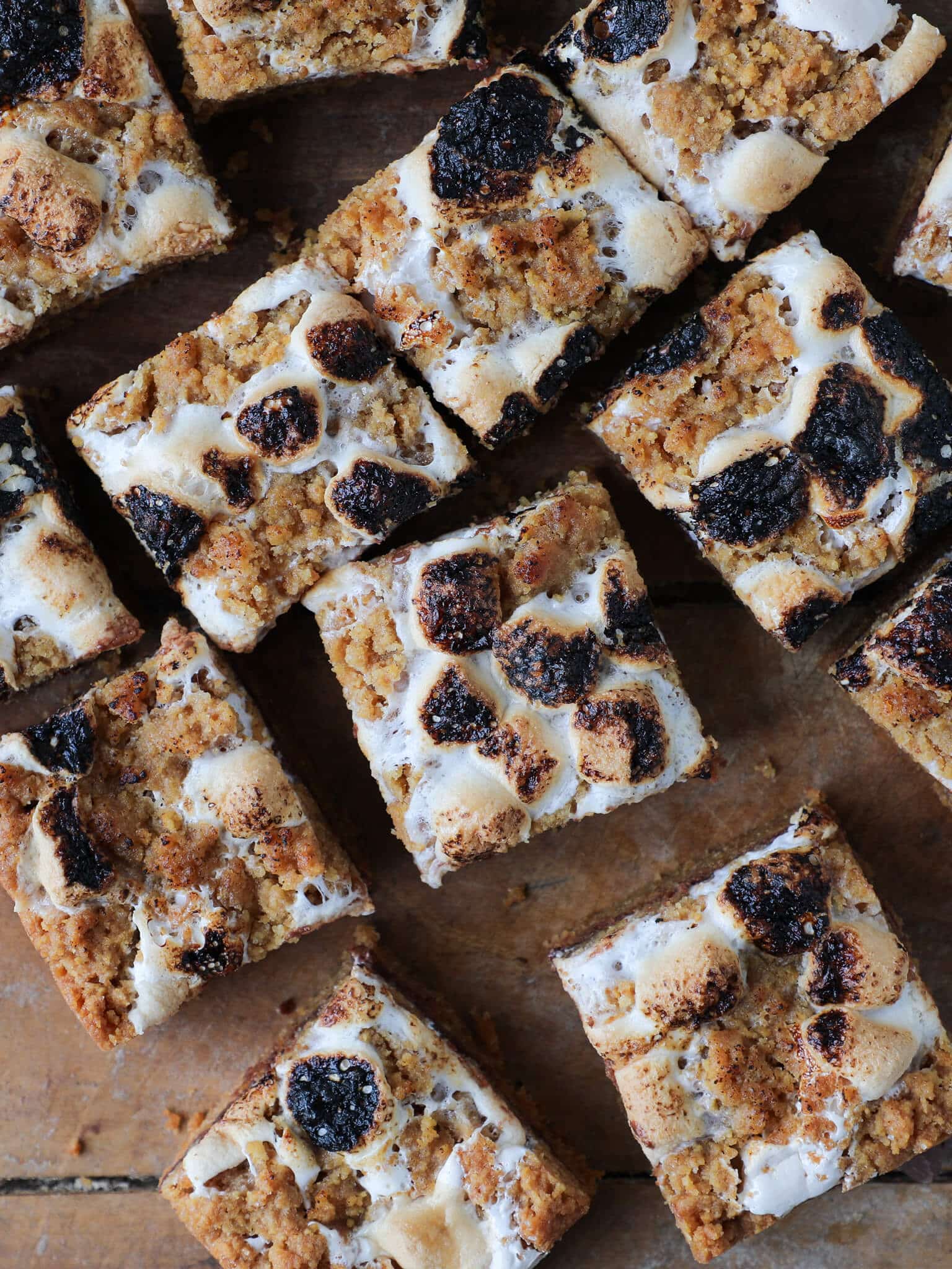 Soft Chewy Smores Crumble Bars arranged on wooden surface