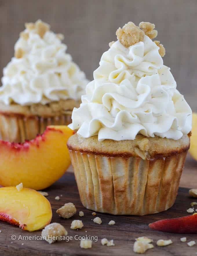 Peach Crisp Cupcakes filled with peach compote and topped with Swiss meringue buttercream