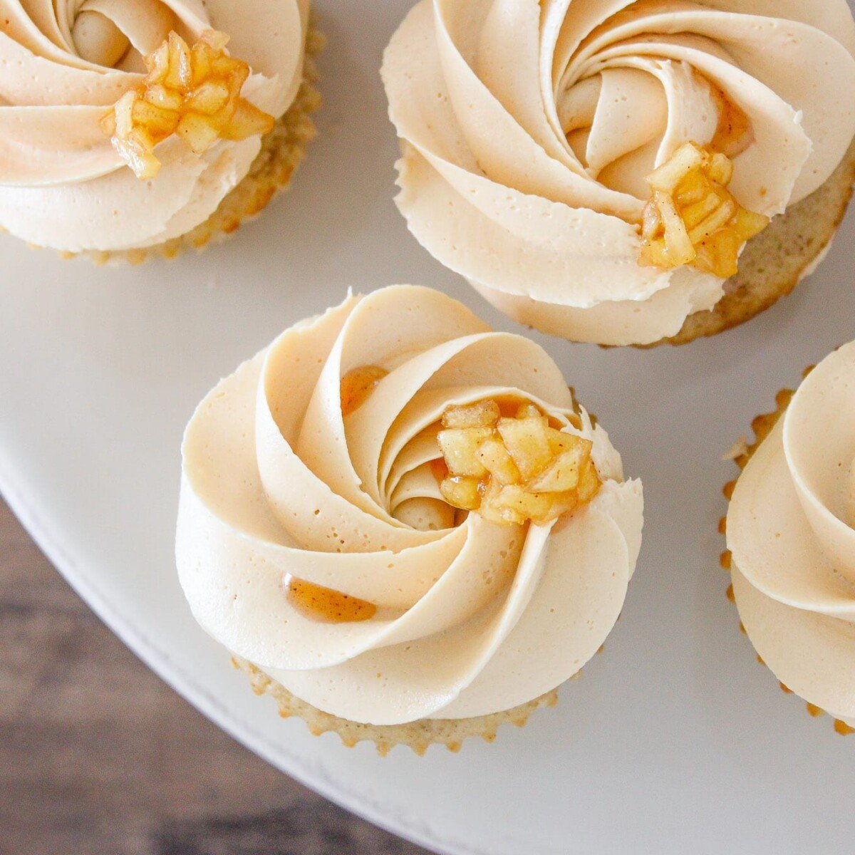 Caramel Apple Cupcakes on marble cake stand.