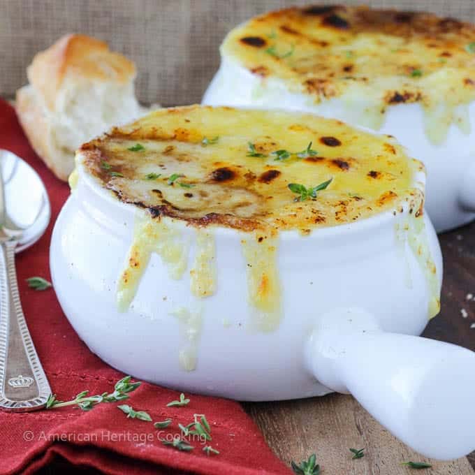 French onion soup with melted cheese on top.