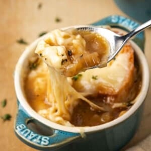 perfect bite of french onion soup on spoon.