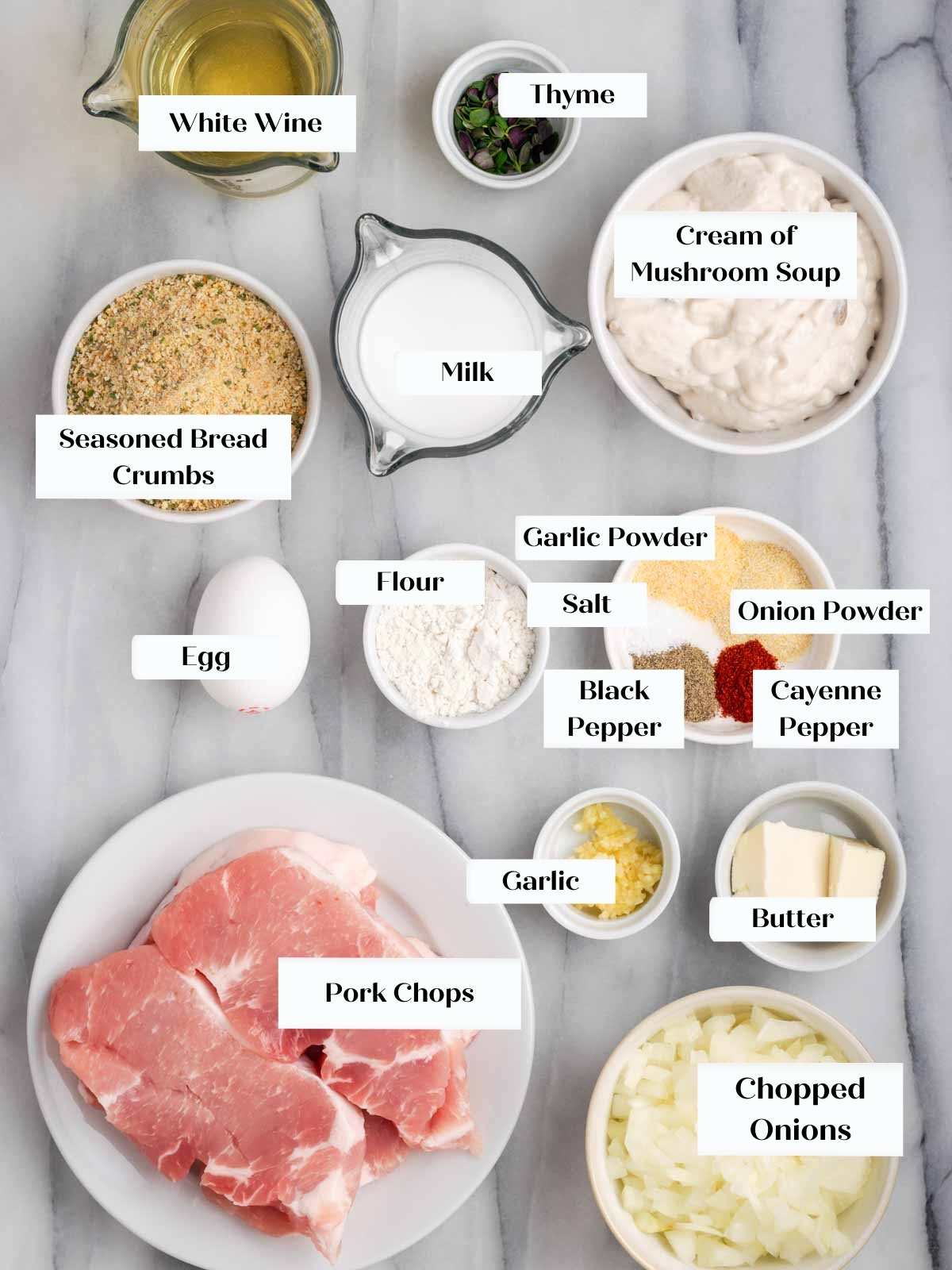 ingredients for pork chops on marble.