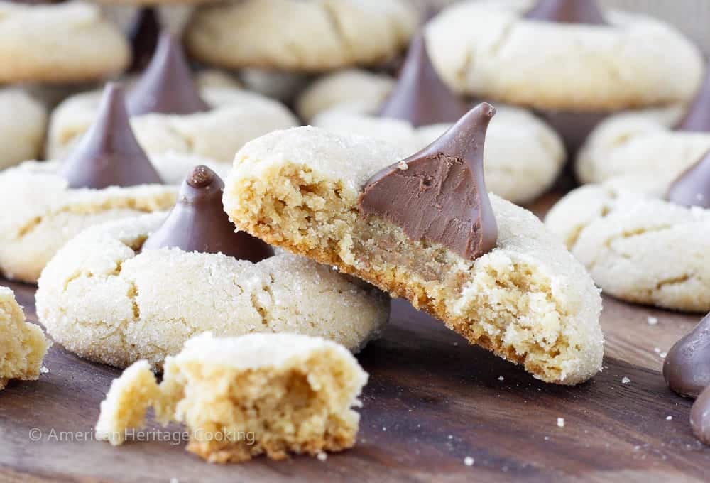 Peanut Butter Blossoms are a classic chewy peanut butter cookie rolled in sugar and topped with a Hershey kiss. A little crisp outside but chewy within!
