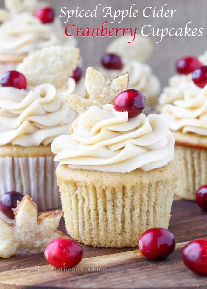 Spiced Apple Cider Cranberry Cupcakes | Soft, moist apple cider cinnamon cake filled with spiced cranberry compote and topped with a cinnamon cream cheese butter cream! And don't forget the sugared pie crust leaf!