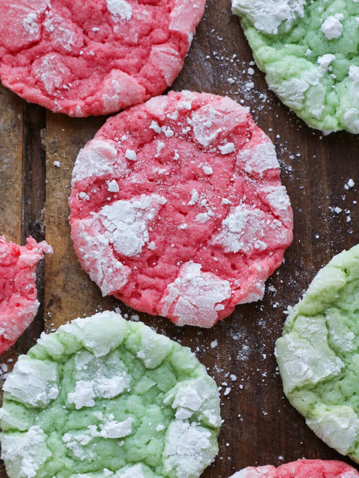 Festive Almond Crinkle Cookies red and green cookies on wood