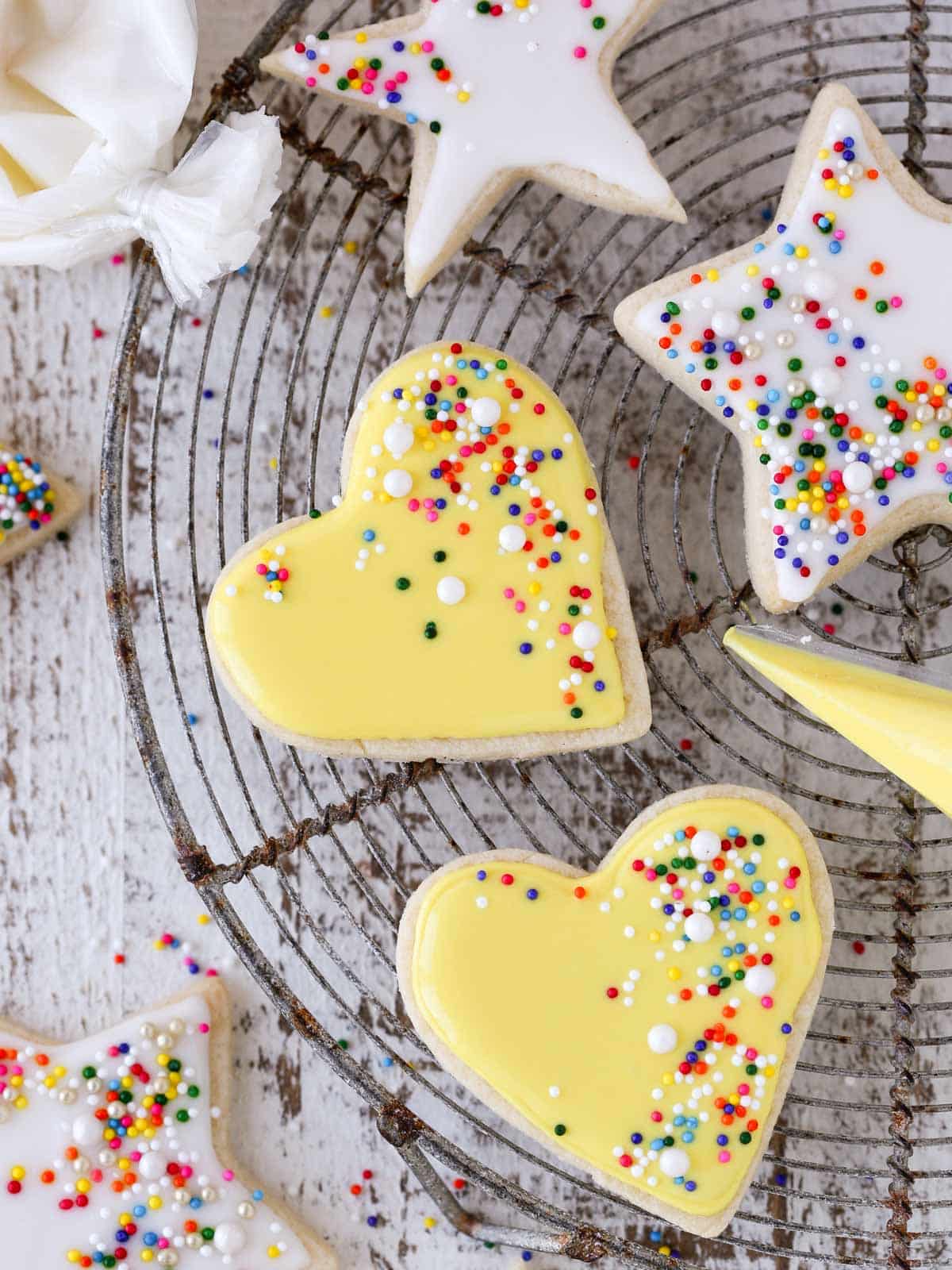 sugar cookies decorated with royal icing white and yellow. 
