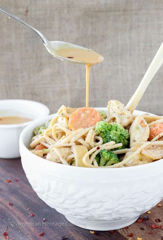 Dinner on the table in less than 20 minutes with this easy Thai Peanut Chicken Noodle Stir Fry!! | Mixed vegetables and chicken are tossed with whole wheat udon noodles and a spicy sweet Thai peanut sauce! 