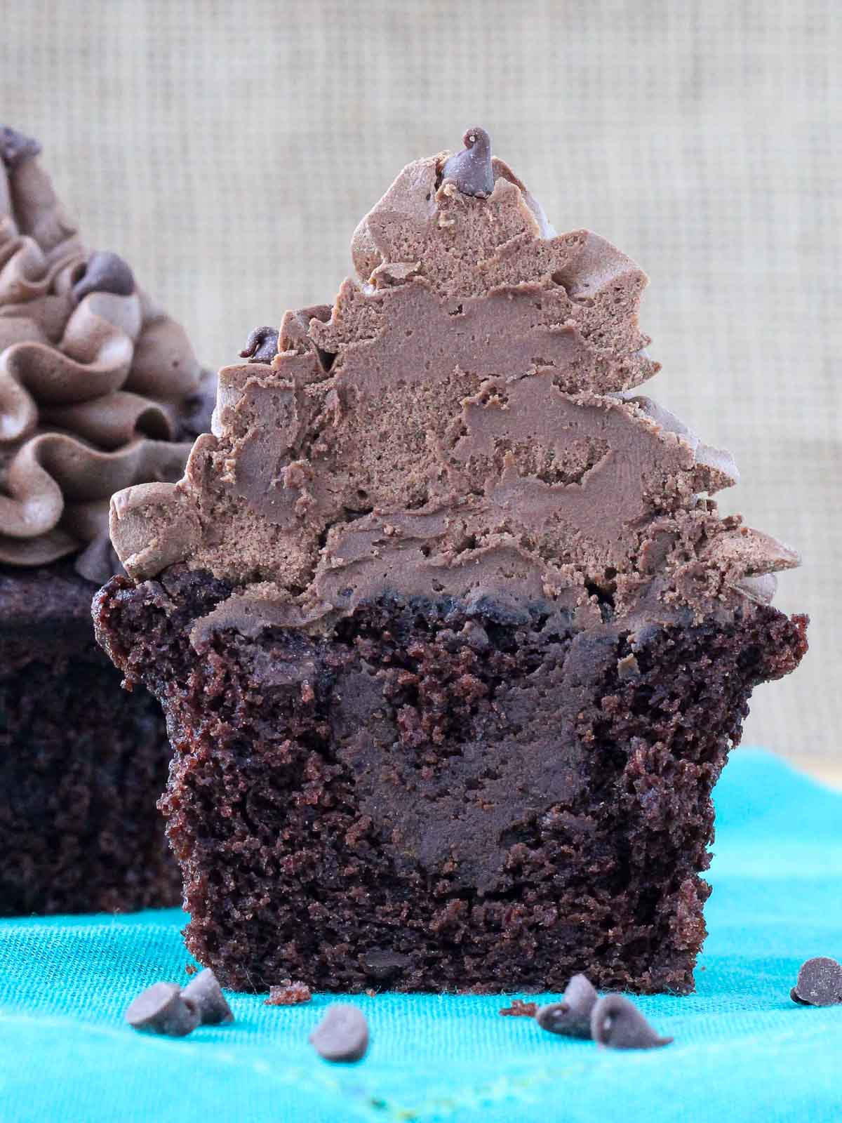 chocolate cupcake with chocolate ganache filling cut in half.