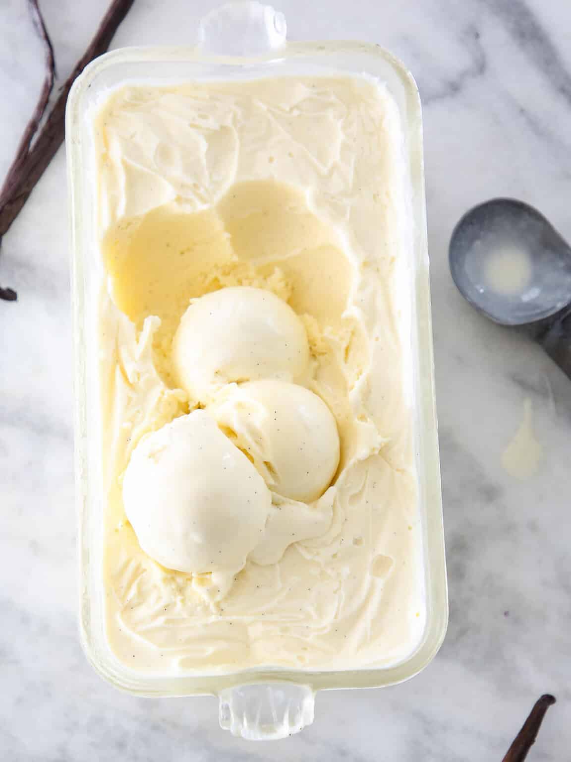 Three scoops of vanilla bean ice cream