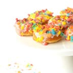 These Fruity Pebble Cereal Milk Baked Donuts are soft, baked vanilla cake donuts that are made using Fruity Pebble infused milk, so you get that delicious Fruity Pebble taste in every bite!