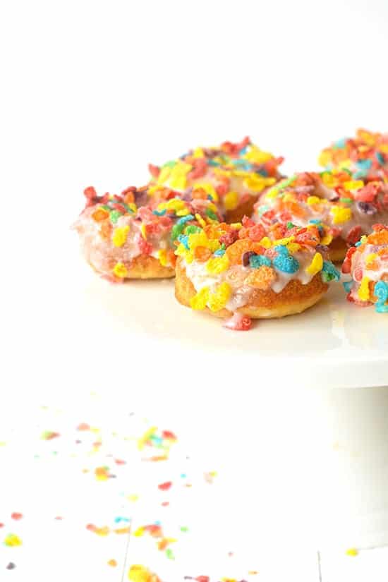 Fruity Pebble Cereal Milk Baked Donuts | soft, vanilla cake donuts made with Fruity Pebble cereal milk for a unique twist on breakfast!