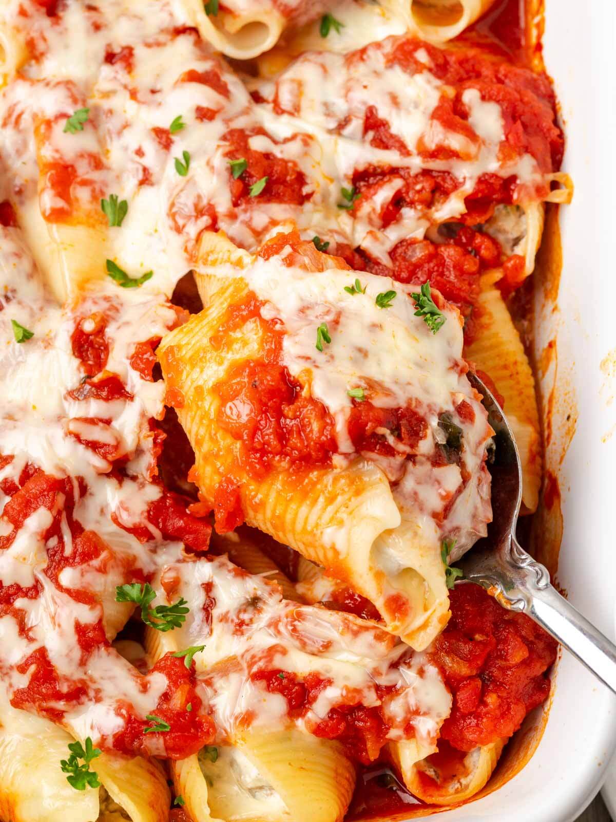 stuffed shells with ground beef in casserole.
