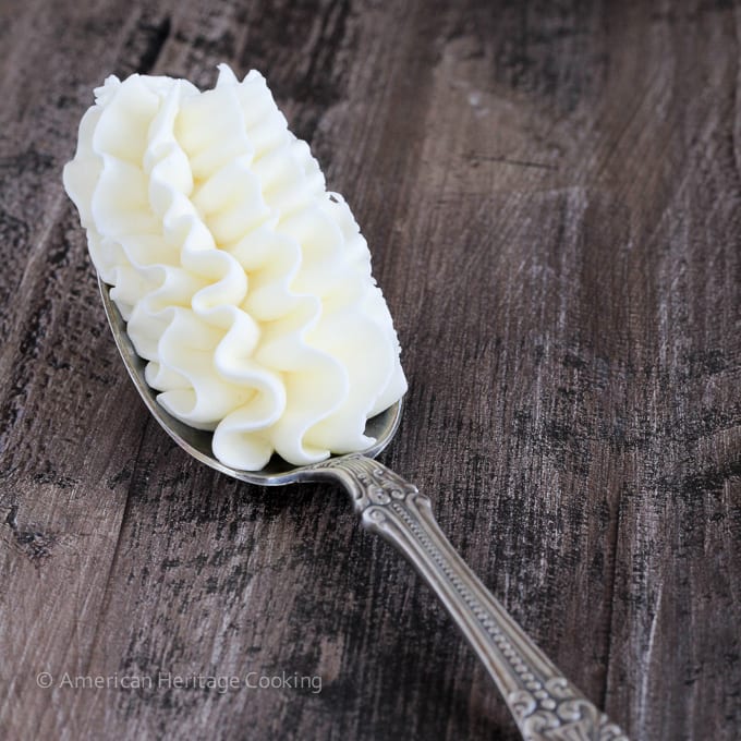 A spoonful of piped white buttercream.