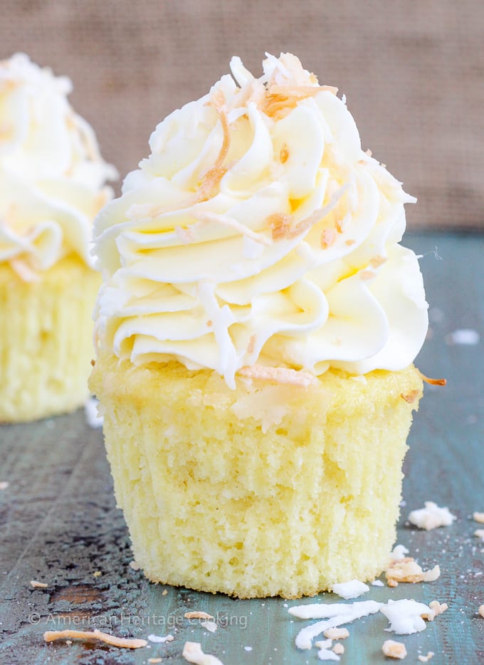 These Lemon Coconut Cupcakes have a moist coconut cake, a sweet, tart lemon curd filling and are topped with a lemon Italian meringue buttercream! 