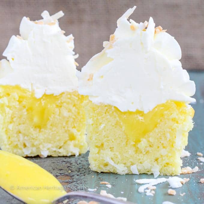 In these Lemon Coconut Cupcakes a moist coconut cupcake that is made with both dried coconut and coconut milk is filled with lemon curd and then topped with a coconut Italian Meringue Buttercream.  And then topped off with some more toasted coconut.