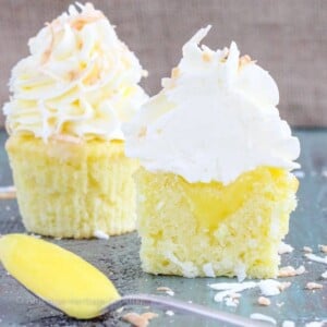 In these Lemon Coconut Cupcakes a moist coconut cupcake that is made with both dried coconut and coconut milk is filled with lemon curd and then topped with a coconut Italian Meringue Buttercream. And then topped off with some more toasted coconut.