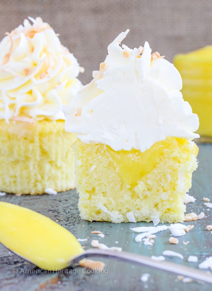 These Lemon Coconut Cupcakes have a moist coconut cake, a sweet, tart lemon curd filling and are topped with a lemon Italian meringue buttercream! 