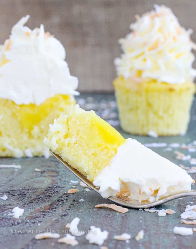 In these Lemon Coconut Cupcakes a moist coconut cupcake that is made with both dried coconut and coconut milk is filled with lemon curd and then topped with a coconut Italian Meringue Buttercream.  And then topped off with some more toasted coconut.
